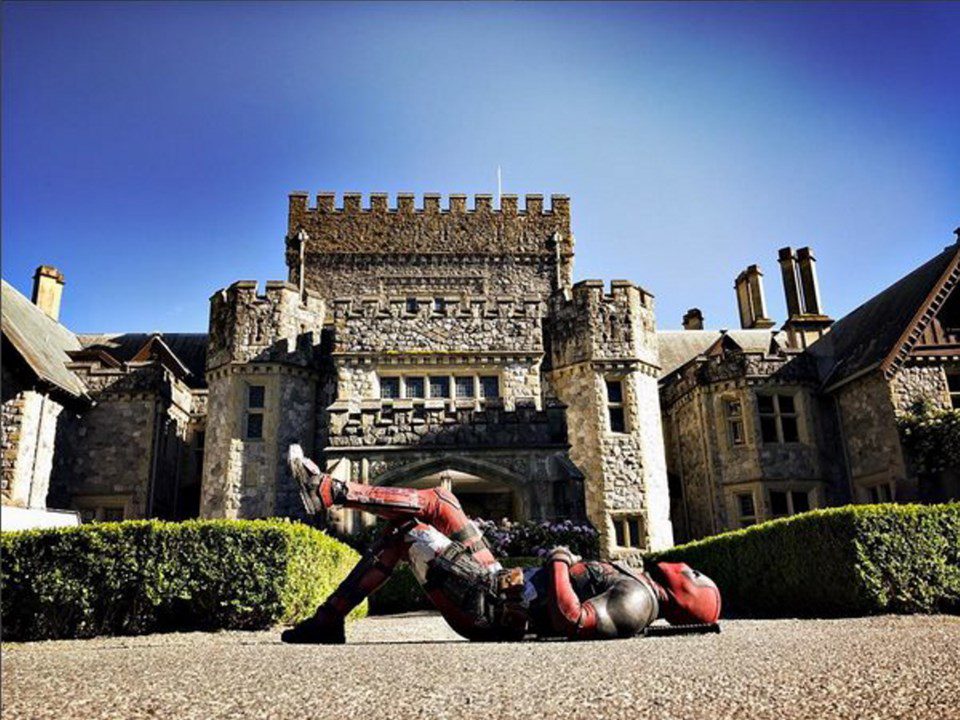 Deadpool lying in front of Hatley Castle in Victoria, British Columbia.